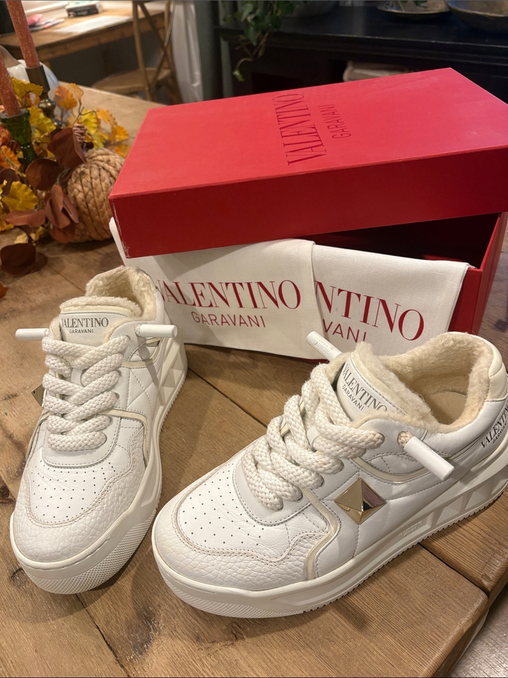 Valentino Garavani Women’s Cream-White Leather Sneakers with Gold Stud.